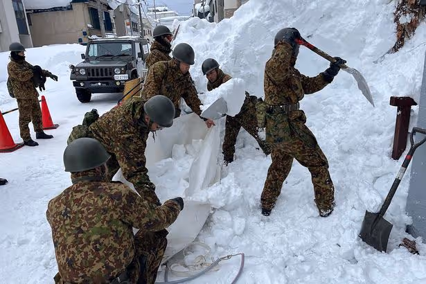 Dozens dead and hundreds injured as brutal 6.5ft snow dump crushes houses