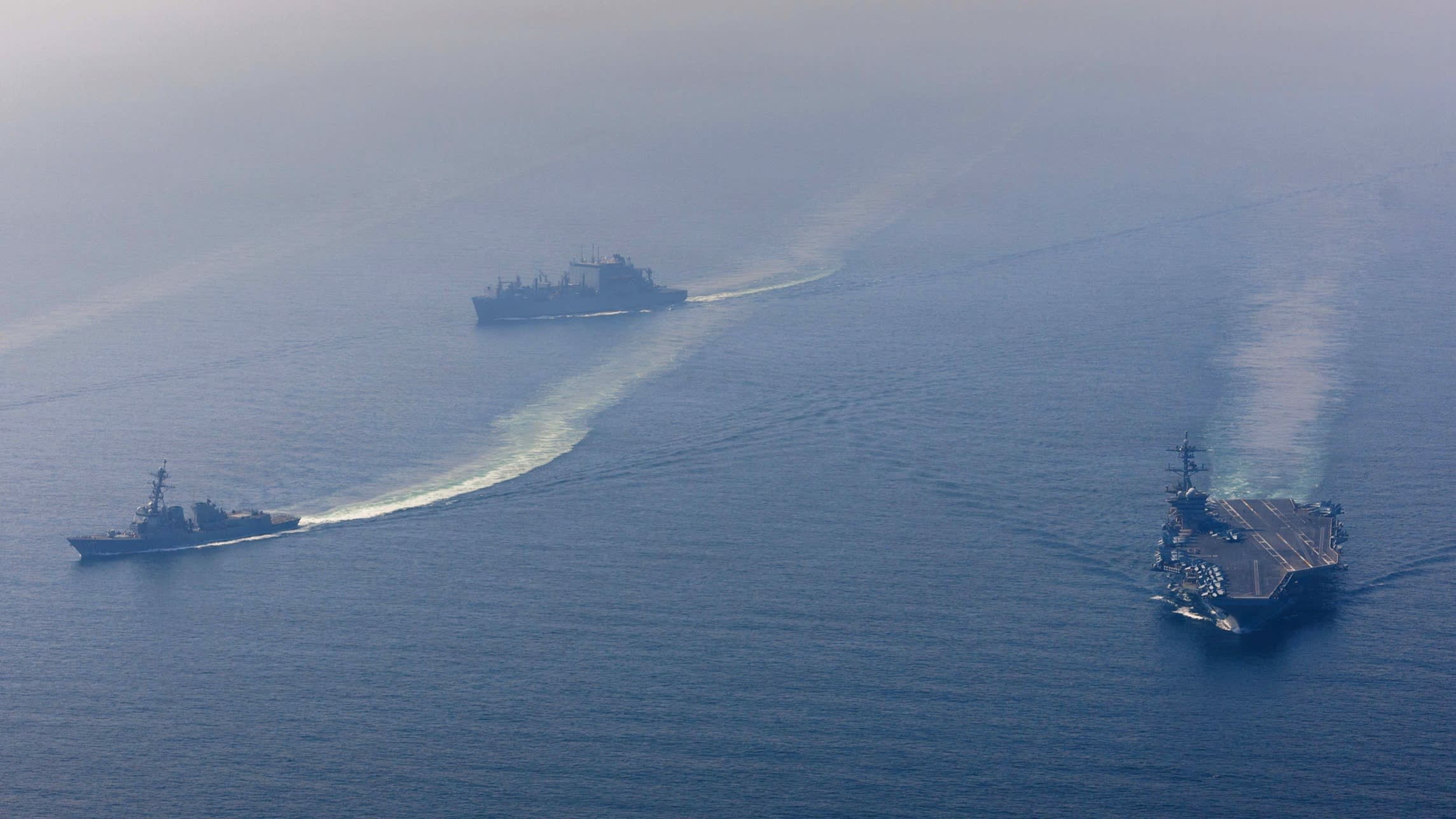 US warns Iran to make a deal as it steps up military deployments